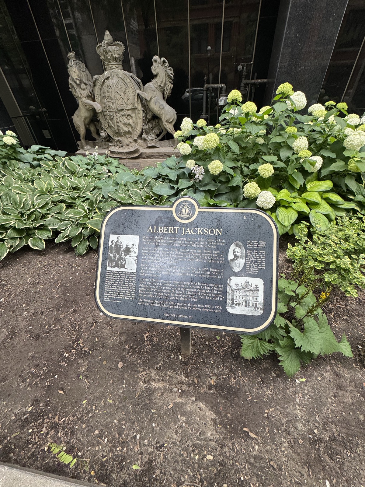 The Heritage Toronto plaque for Albert Jackson standing at the site of the old Toronto General Post Office