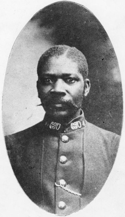 Historical oval portrait of Albert Jackson as a young man in his letter carrier uniform